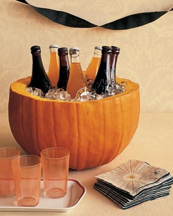 creative-idea-for-pumpkin-which-the-pumpkin-is-cut-into-half-for-placing-ice-cube-and-beverage-bottle-for-table-decoration-halloween